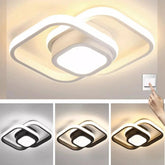 Ceiling light fixture with multiple color options and a hand pointing at it.