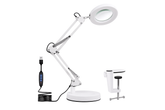 White adjustable desk lamp with magnifying glass attachment on a white background