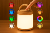 Wooden lantern with color-changing lights on a wooden surface