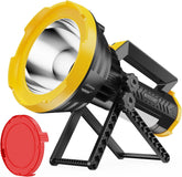 Yellow and black portable light with red lens cap on a white background