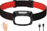 Black and red dog collar with LED light and USB cable on a white background