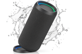 Black Bluetooth speaker with water splashes on a white background