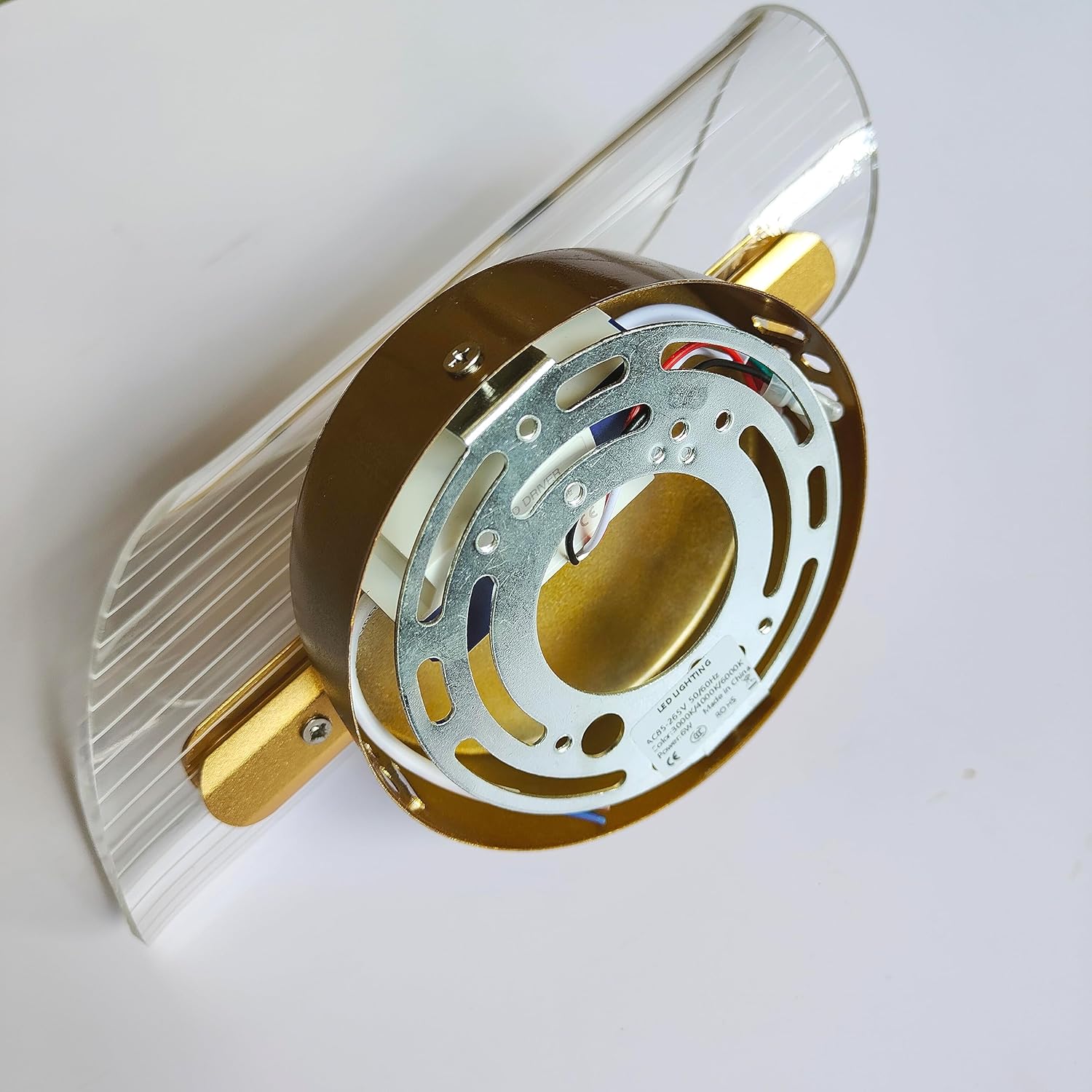 Versatile spiral-shaped LED wall sconce used as decorative lighting in a modern home