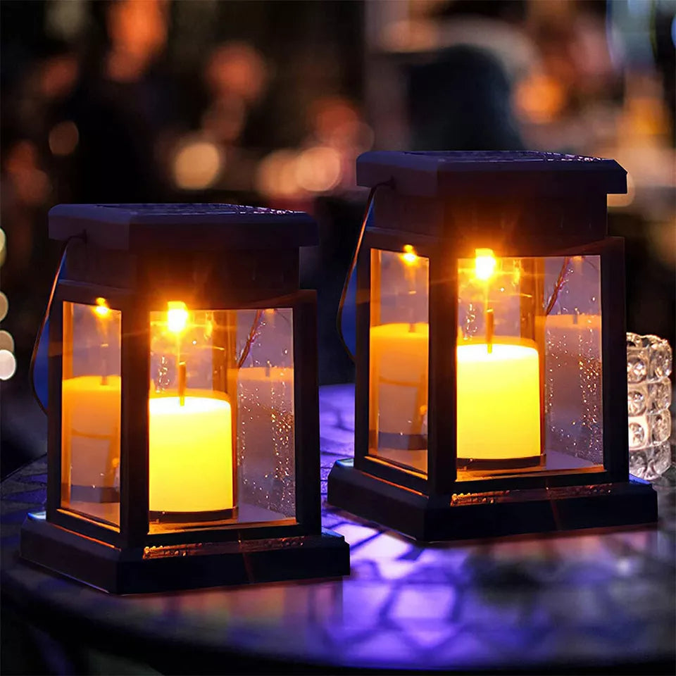 Lanterns placed along a garden path with ground stakes

