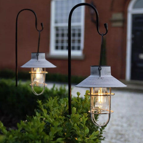 Solar-powered garden lantern with retro filament LED design

