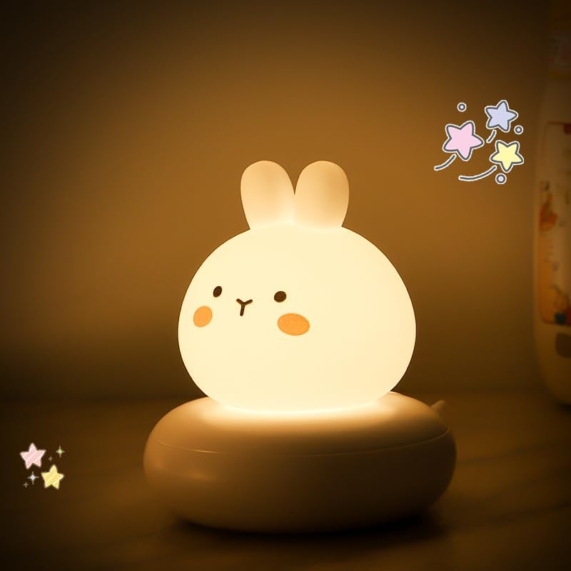 Cute rabbit-shaped night light on a dark background