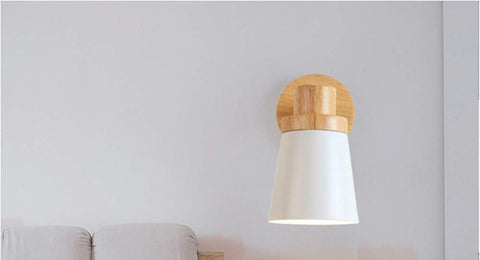 Energy-efficient E27 LED bulb inside a wooden wall sconce lamp