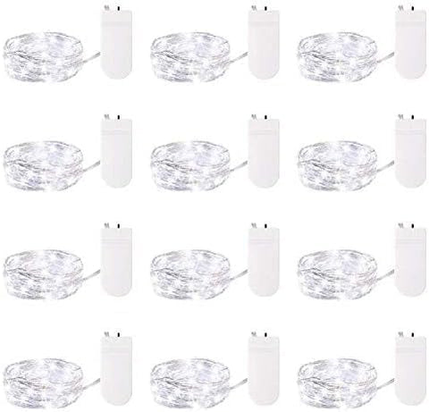 LED fairy lights illuminating glass vase

