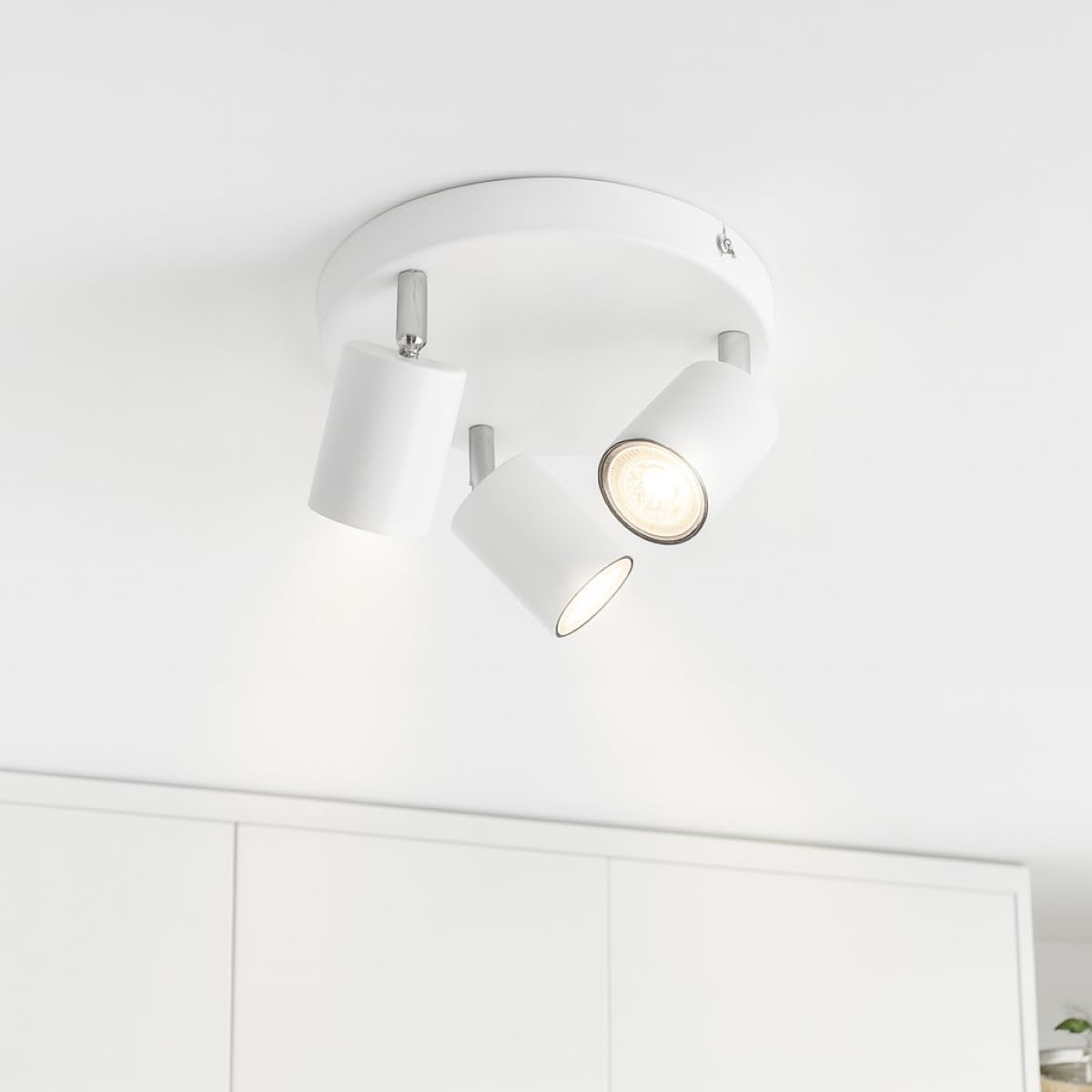 White ceiling light fixture on a white ceiling