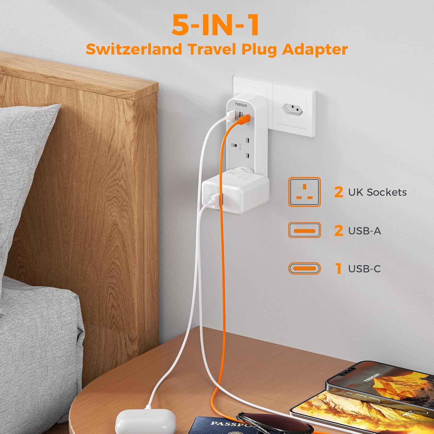 5-in-1 Switzerland Travel Plug Adapter with multiple sockets and USB ports on a table.