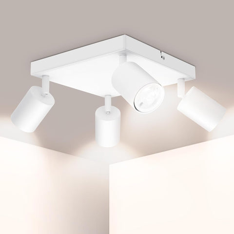 Modern ceiling light fixture with four lights on a neutral background