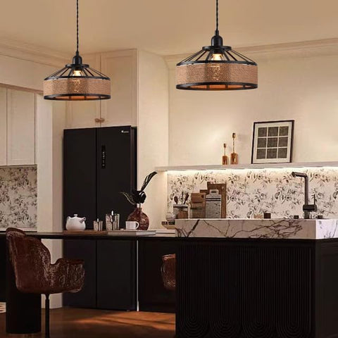 Modern kitchen with pendant lights, island, and decor elements.