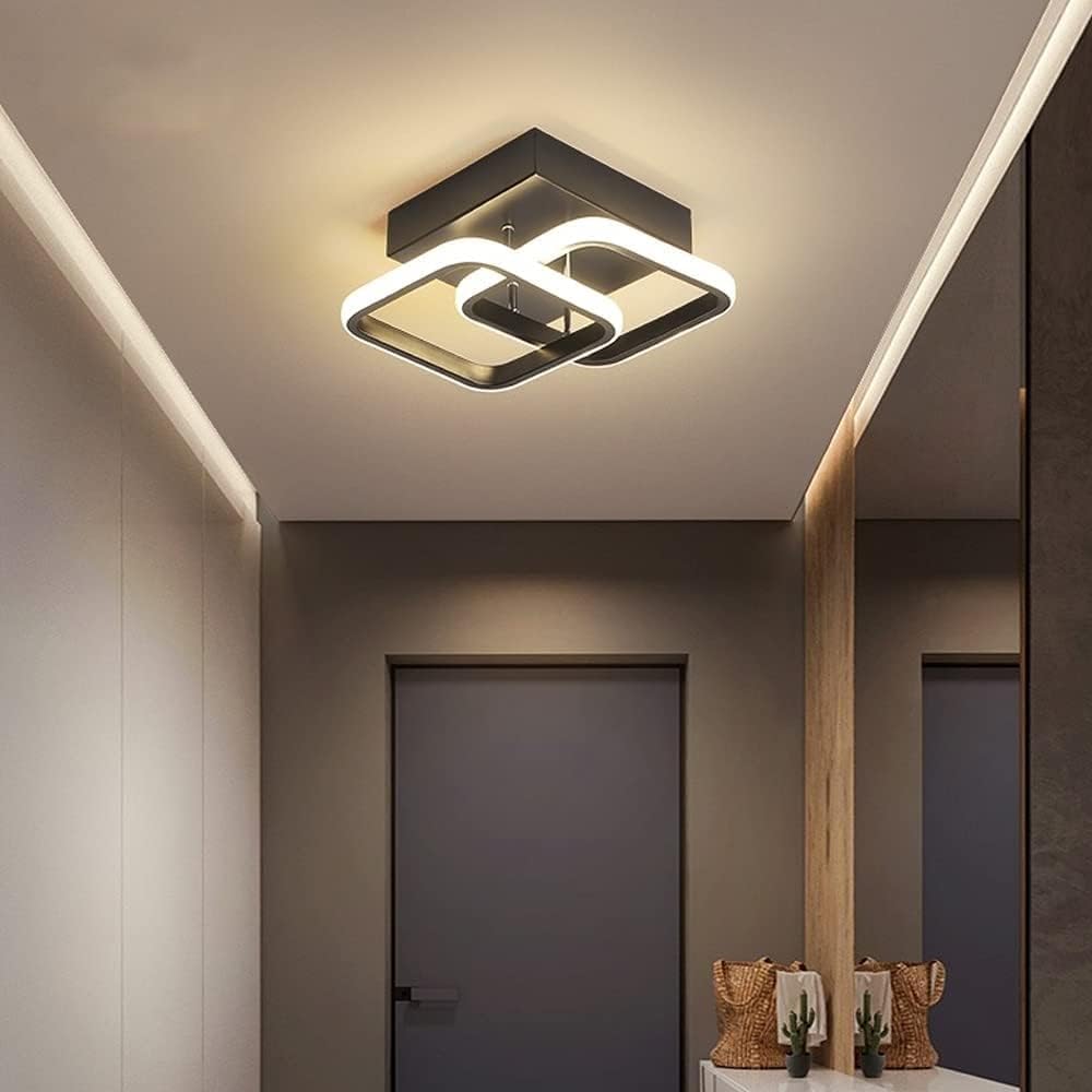 Modern ceiling light fixture in a room with neutral walls and decor.