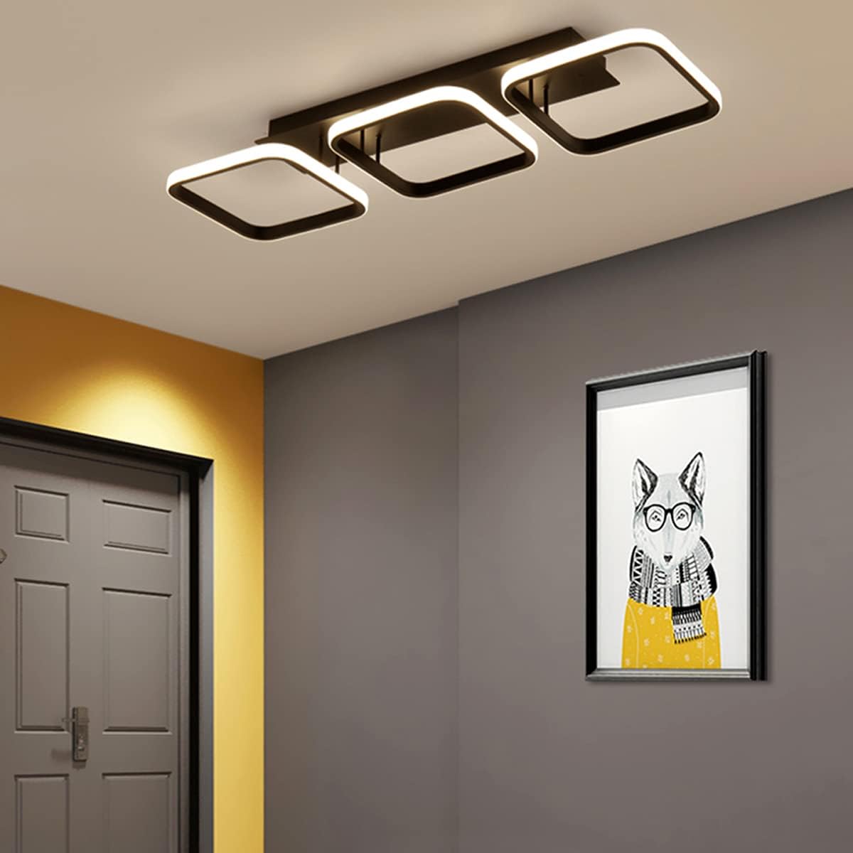 Ceiling light fixture in a room with a wall painting of a fox wearing glasses and a scarf.