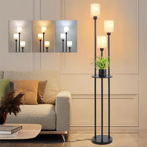 Modern floor lamp with plant in a living room setting