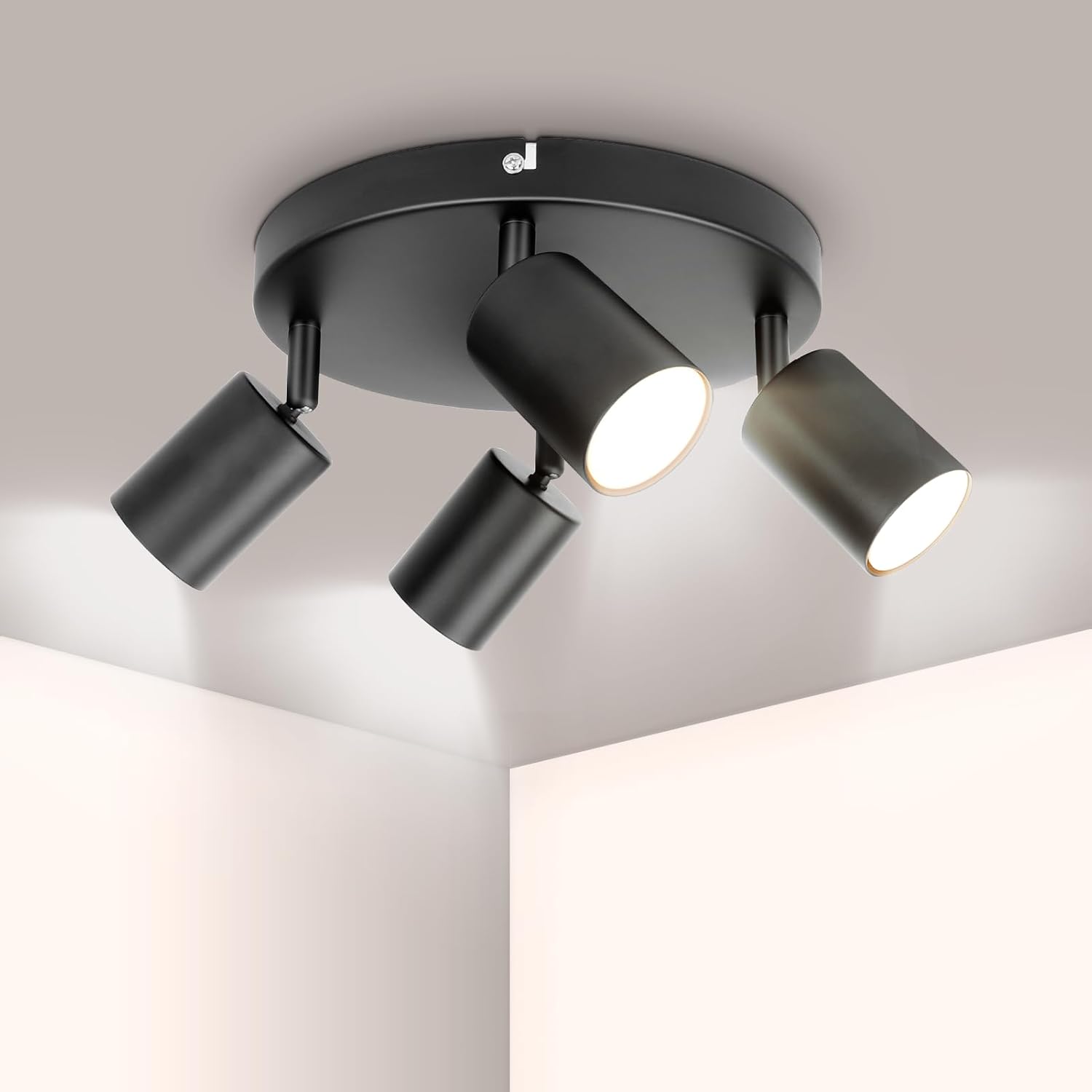 Modern ceiling light fixture with four lights on a neutral background