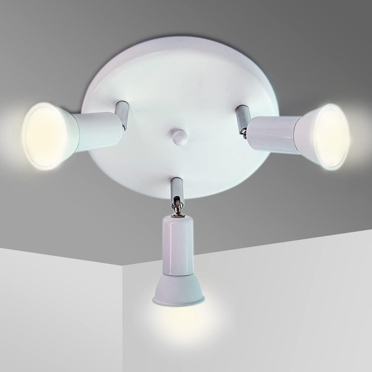 Ceiling light fixture with three white bulbs on a gray ceiling.