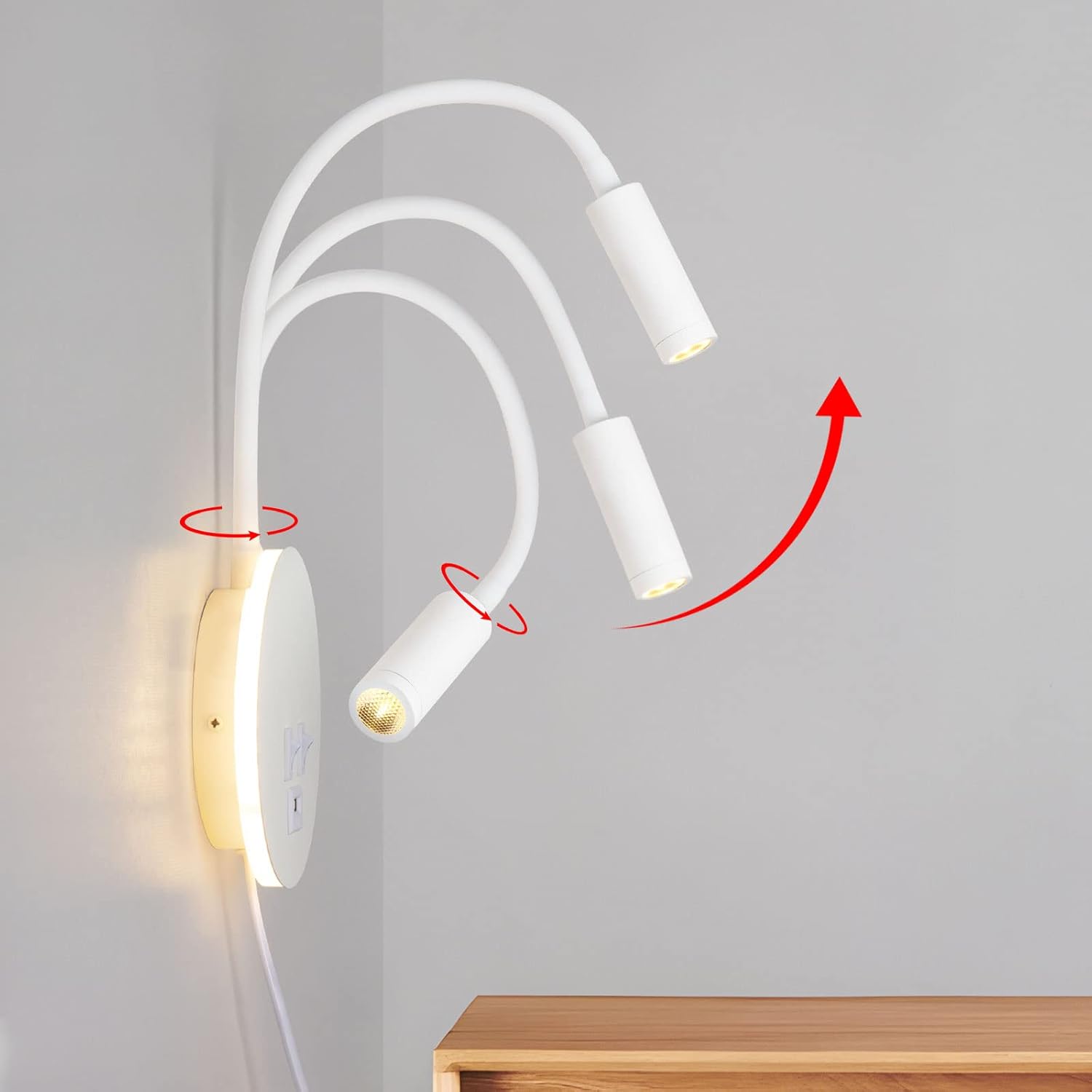 Modern wall-mounted light fixture with adjustable arms on a plain background