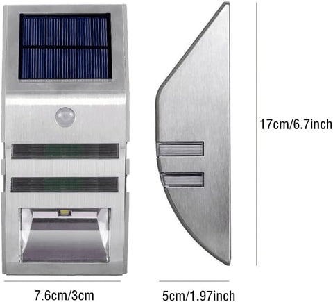 Pack of 4 LED solar security lights mounted on a fence at night

