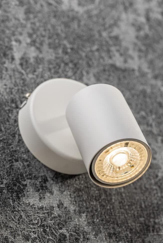 White cylindrical light fixture on a textured gray background