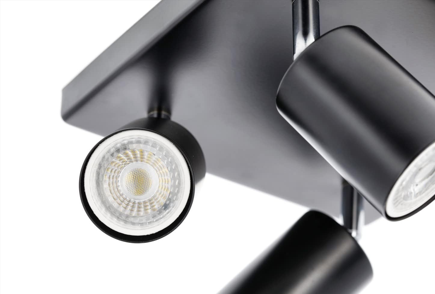 Black ceiling light fixture with two adjustable lights on a white background