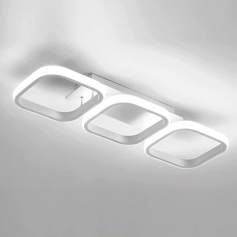 Modern ceiling light fixture with three rectangular panels on a gray background