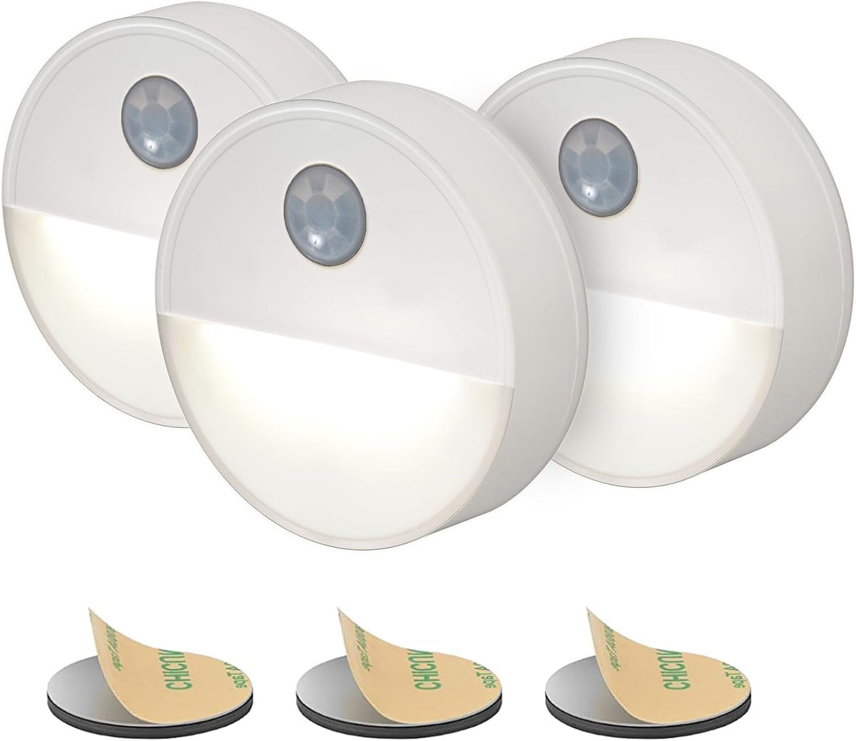 Three motion sensor lights with adhesive pads on a white background
