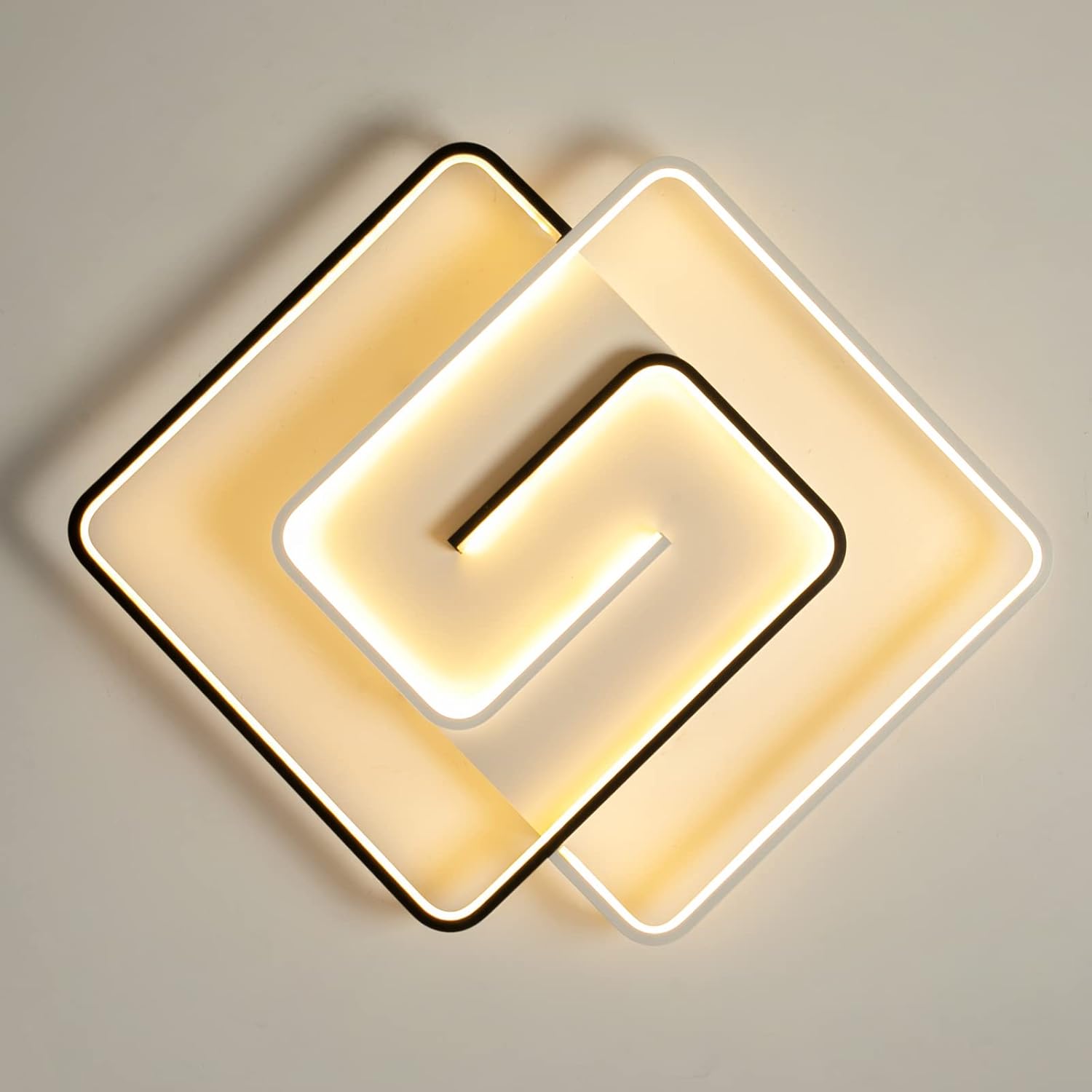 Modern ceiling light fixture with geometric design on a neutral background