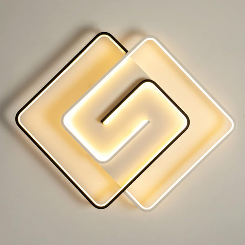 Modern ceiling light fixture with geometric design on a neutral background