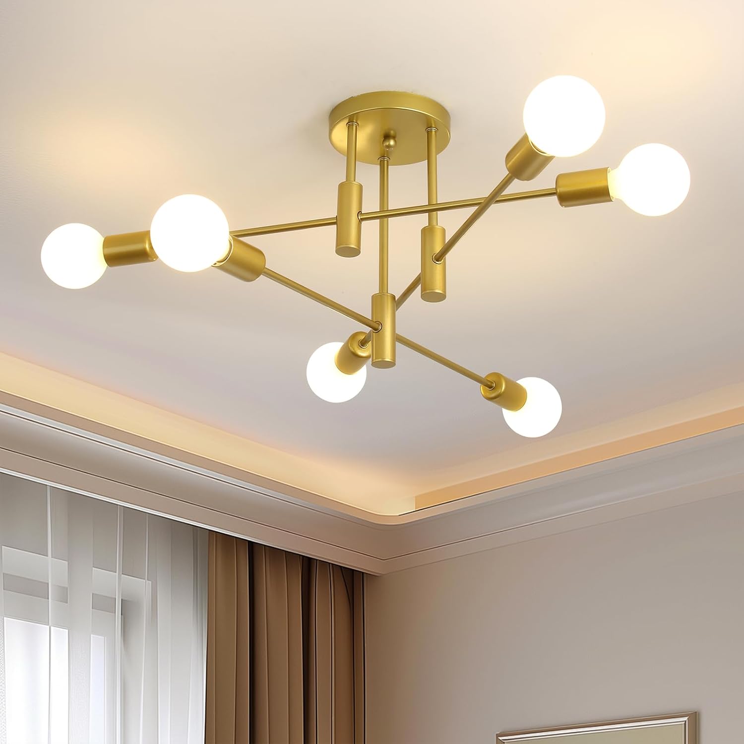 Modern gold chandelier with multiple light bulbs in a room setting.