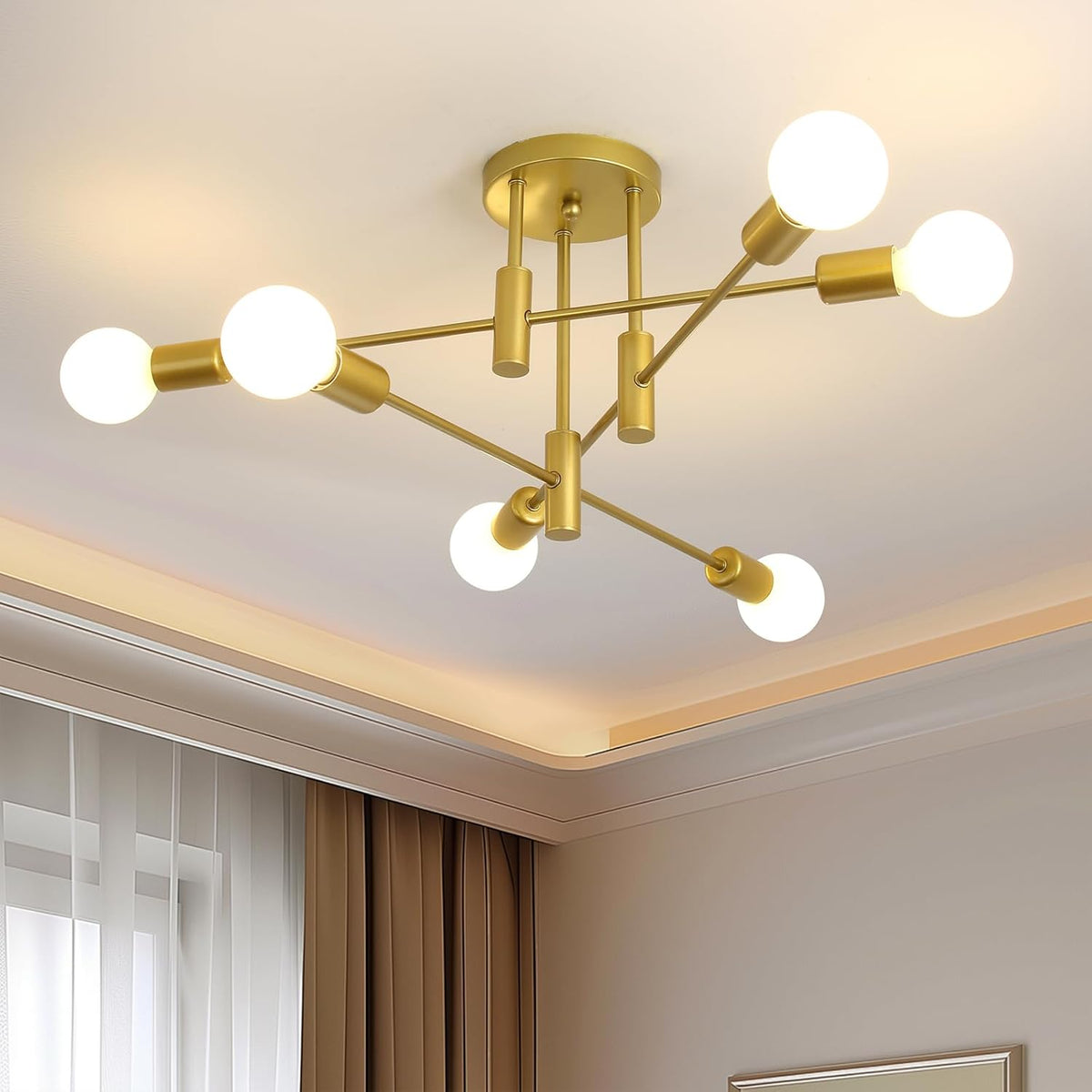 Modern gold chandelier with multiple light bulbs in a room setting.