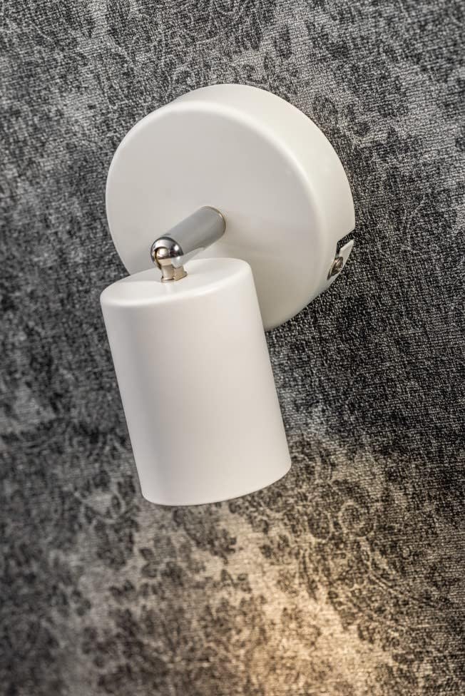 White wall light fixture on a textured gray wall