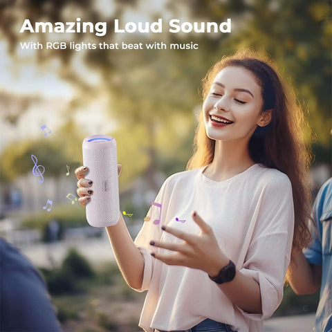 Woman holding a portable speaker with RGB lights and text 'Amazing Loud Sound' and 'With RGB lights that beat with music'.