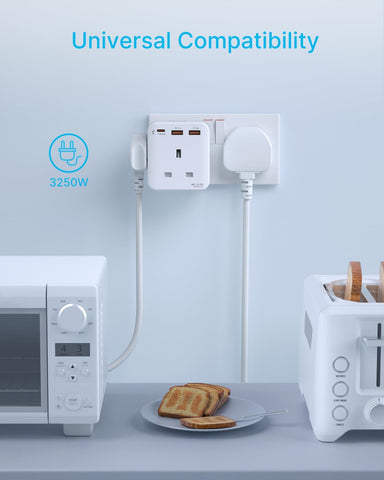 Universal compatibility adapter with multiple outlets and ports on a kitchen counter.