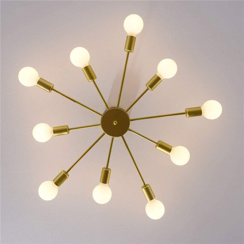 Gold ceiling light fixture with multiple bulbs on a plain background