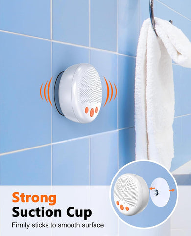 White suction cup with orange accents on a blue tiled wall, featuring text about strong suction.