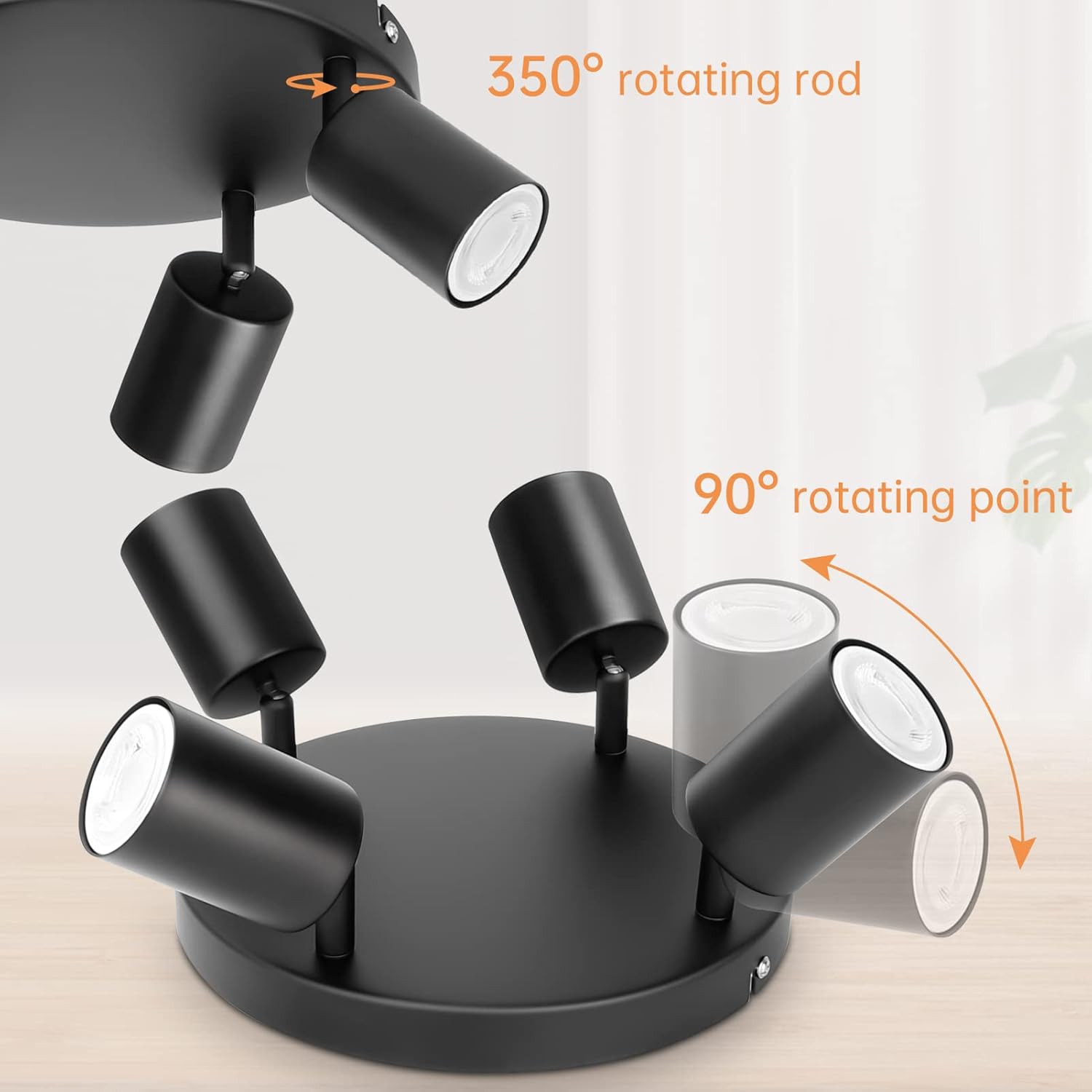 Black ceiling light fixture with rotating features on a neutral background