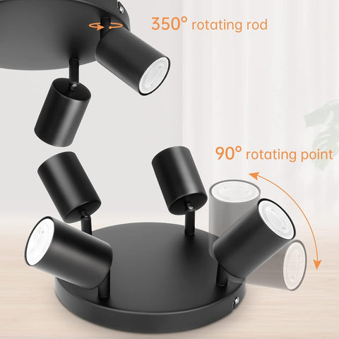 Black ceiling light fixture with rotating features on a neutral background