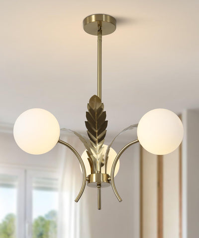Modern chandelier with gold leaf design and two white glass shades on a neutral background.