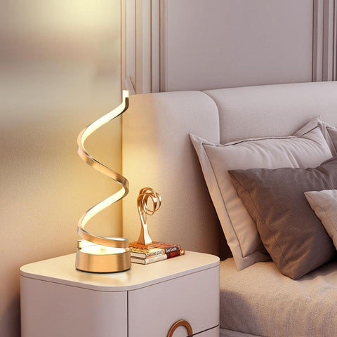 Decorative lamp on a nightstand next to a bed with pillows