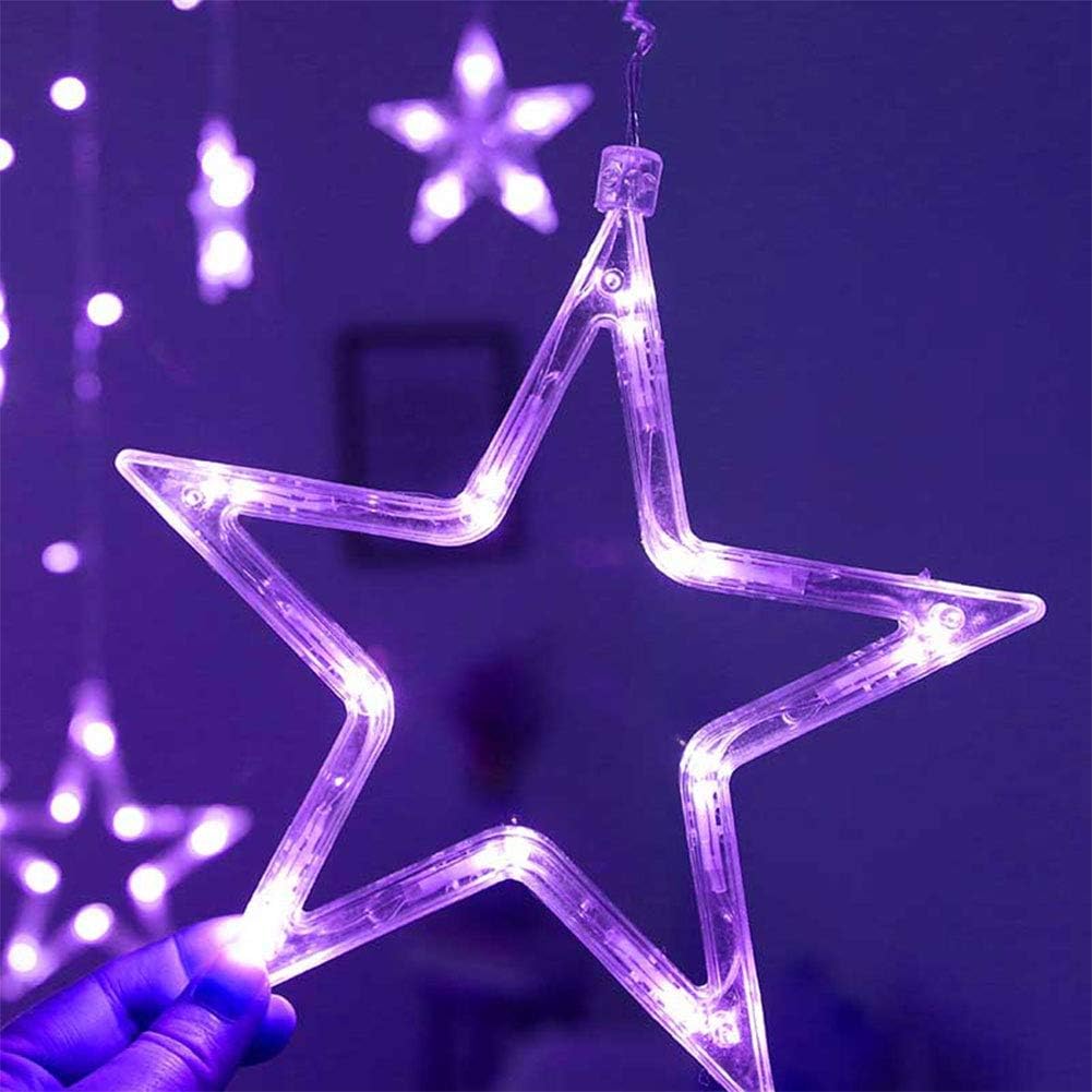 Star-shaped LED light held against a dark background with more star lights.