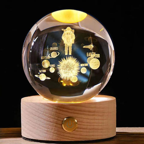 3D Crystal Ball Night Light on a study desk.


