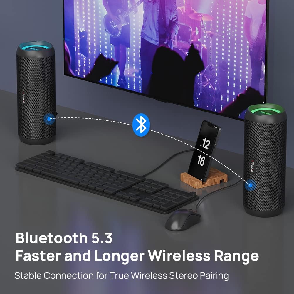 Wireless stereo system with Bluetooth connectivity on a desk setup.