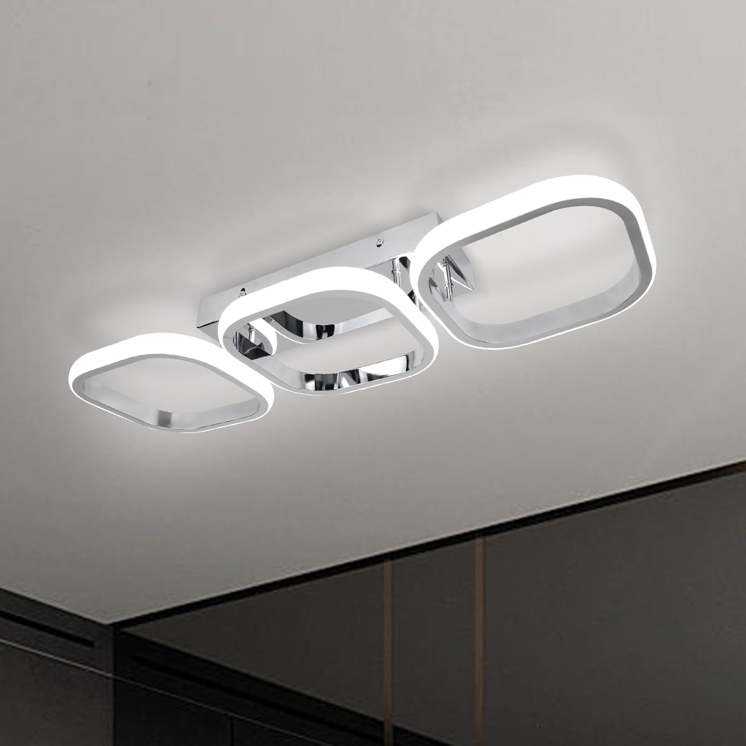 Modern ceiling light fixture on a neutral background
