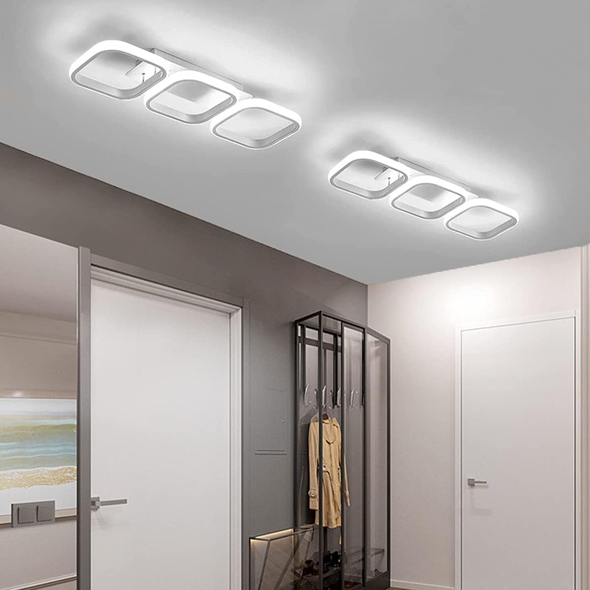 Modern ceiling lights in a room with a wardrobe and mirror.
