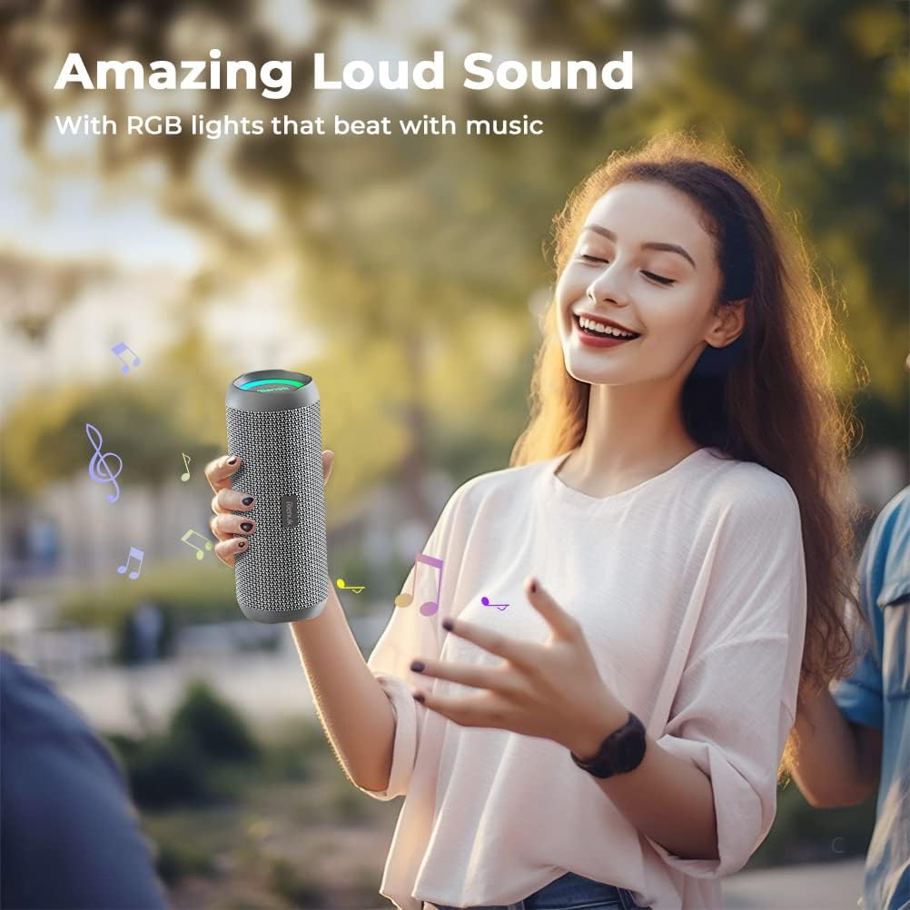 Woman holding a wireless speaker with RGB lights, outdoors.