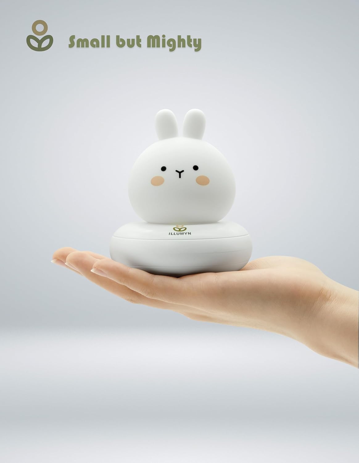 Small white rabbit-shaped device held in a hand with 'Small but Mighty' branding.