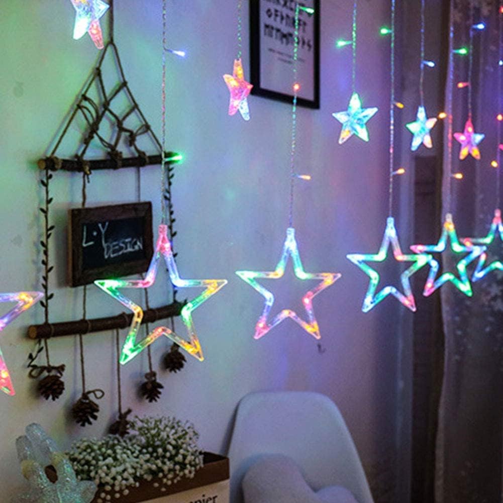 Star-shaped LED string lights hanging on a wall with decorative items.