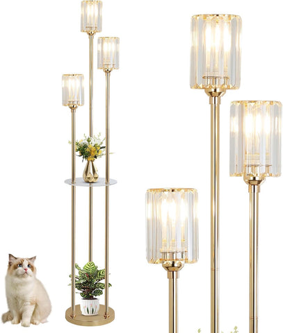 Set of gold floor lamps with glass shades on a white background, one with a cat sitting next to it.