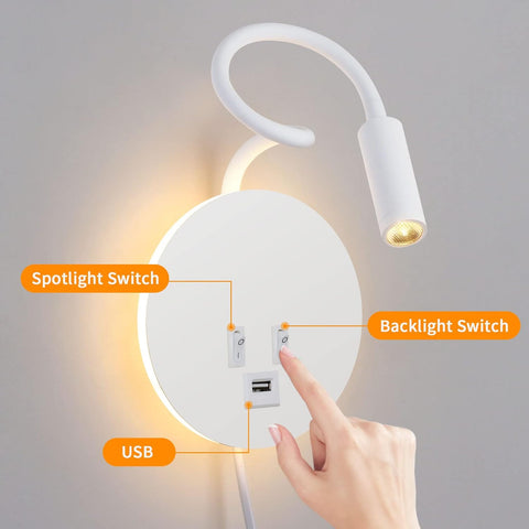 Hand pressing a switch on a wall-mounted light fixture with labeled components.